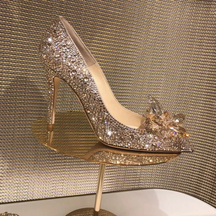 Women's gold stiletto heels with rhinestone decoration and pointed toe