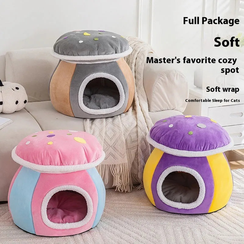Grey mushroom-shaped plush cat bed with an entrance hole, shown on a wooden floor.