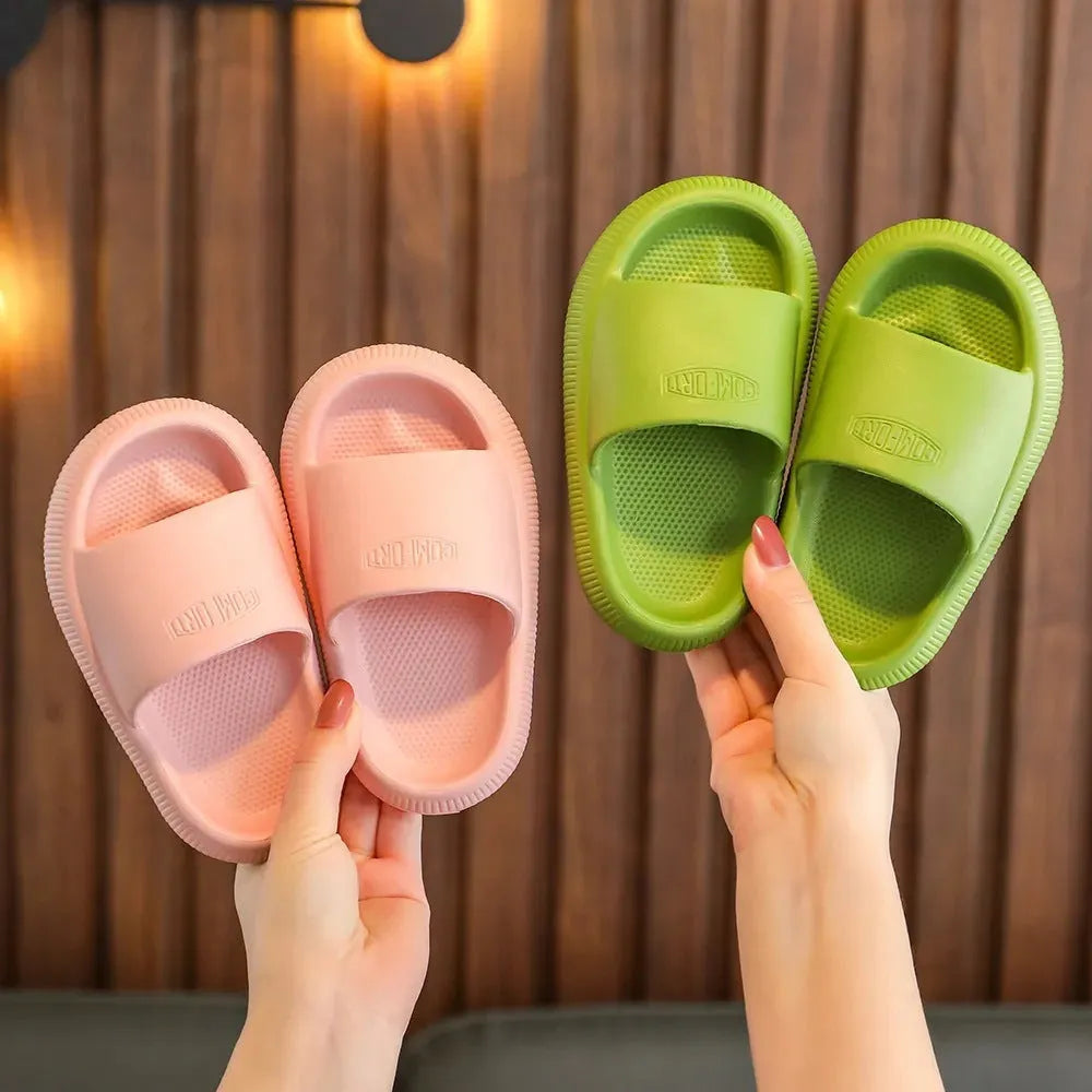Children's mixed colour EVA slippers with a non-slip sole, shown in blue, green, orange, pink, and yellow.
