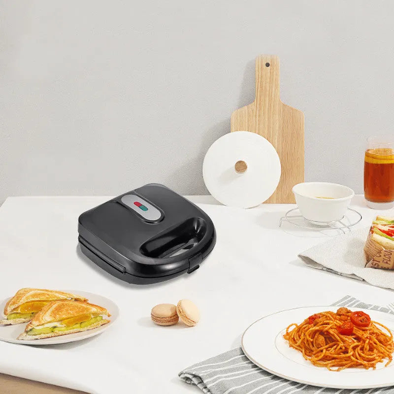 Black electric sandwich pan with double-sided heating, non-stick coating, and six exchangeable pans