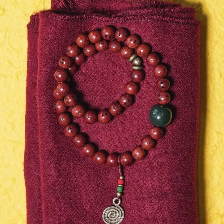 Natural bodhi seed double circle bracelet with cartoon style elements on wrist
