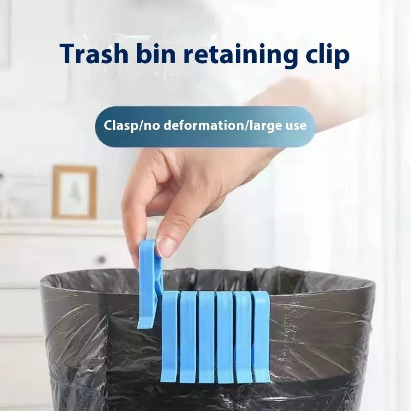 Green and black non-slip plastic clip for holding a bin bag on a wheelie bin rim.