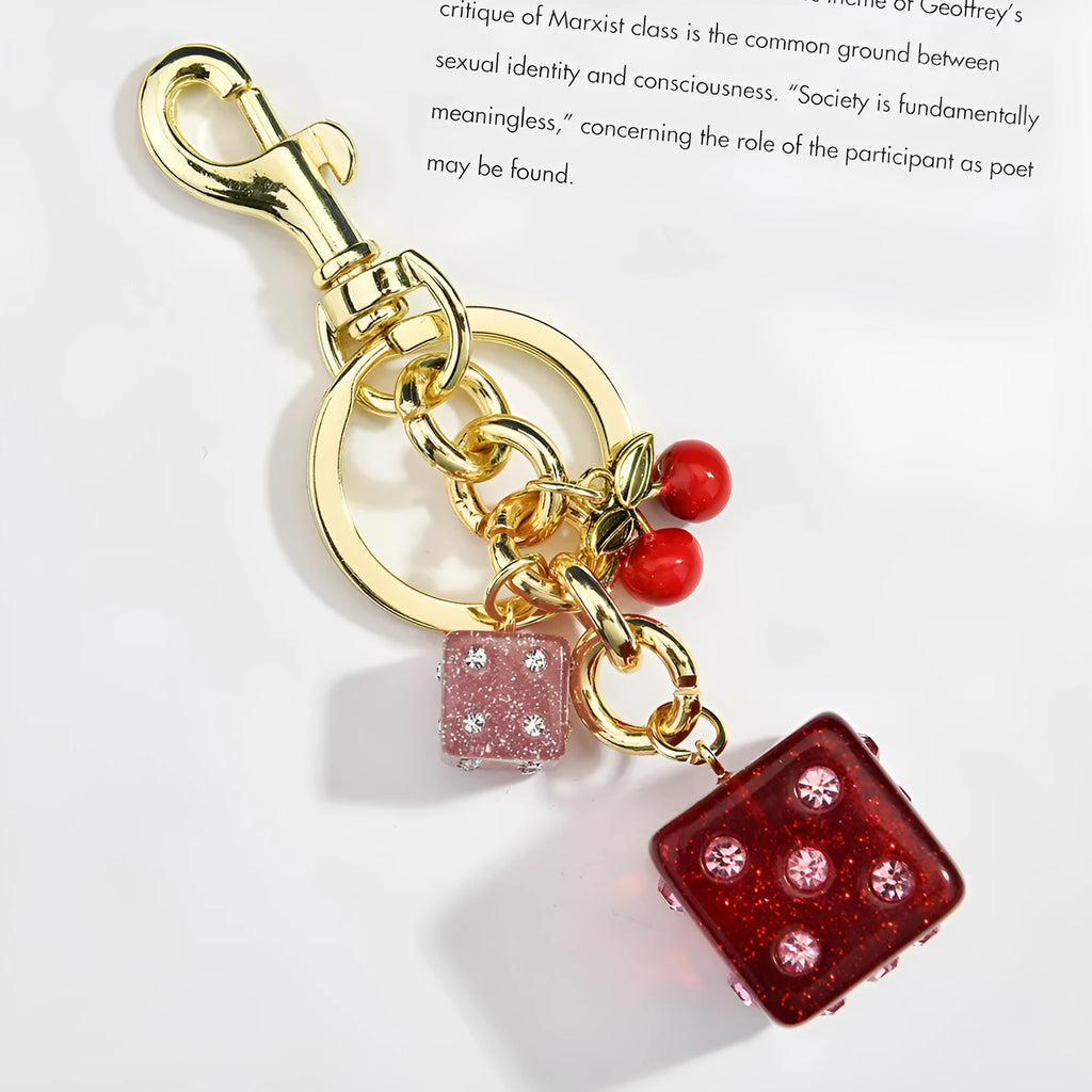 Square metal keychain pendant featuring a vintage cherry red and white two-tone dice pattern.