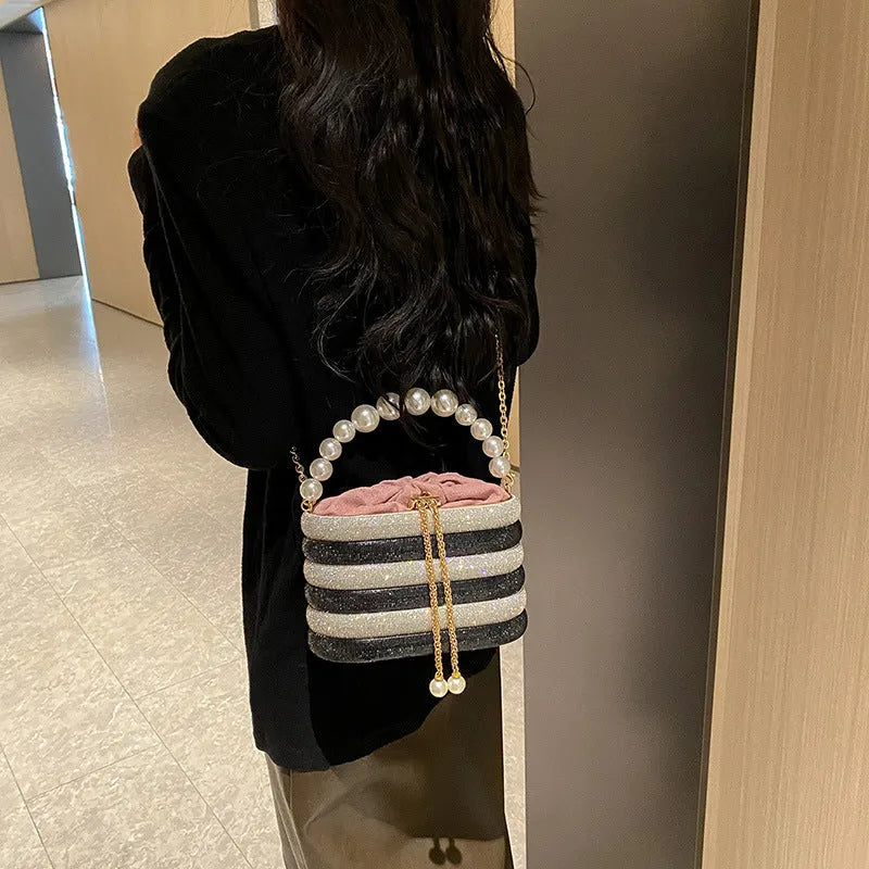 Women's European retro style crossbody bag with pearl bead embellishments and soft PU construction in round suitcase shape