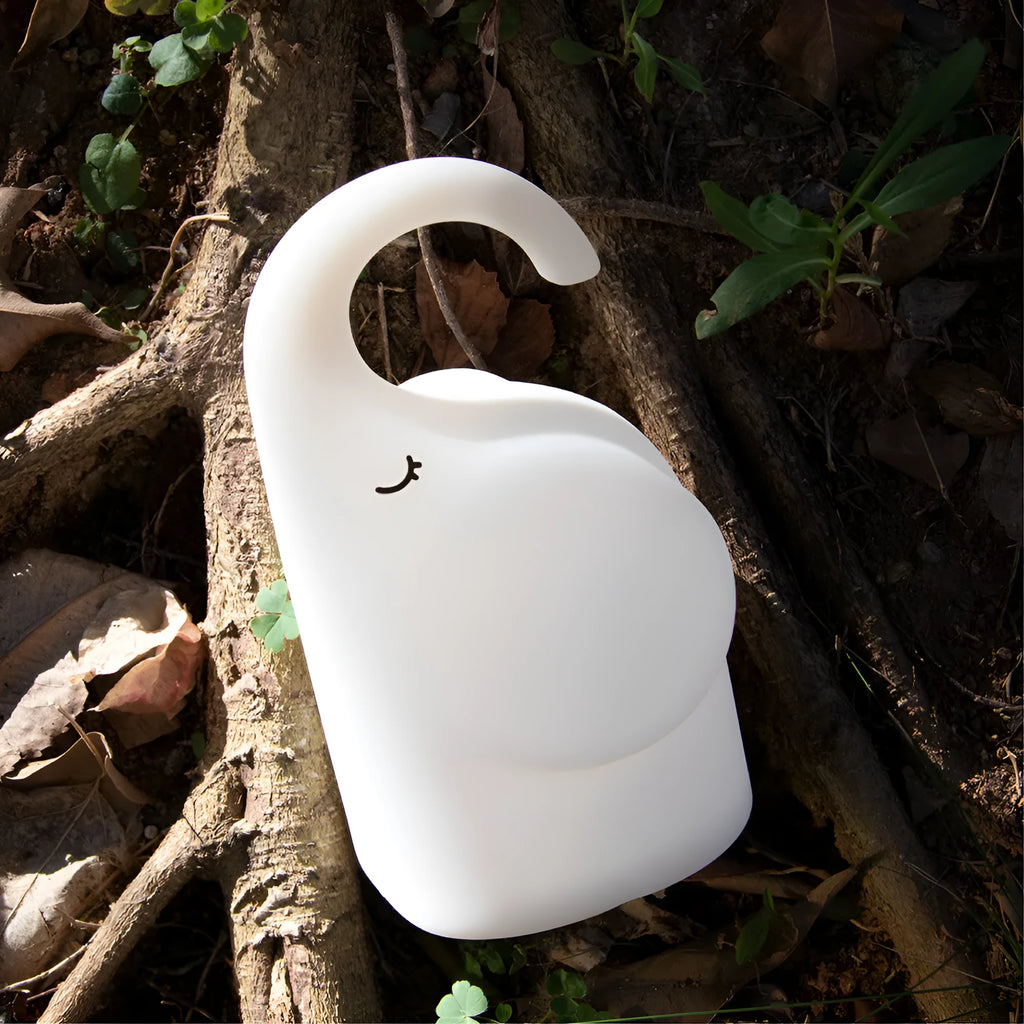 DOMI Elephant-shaped silicone and plastic night light with warm white glow.