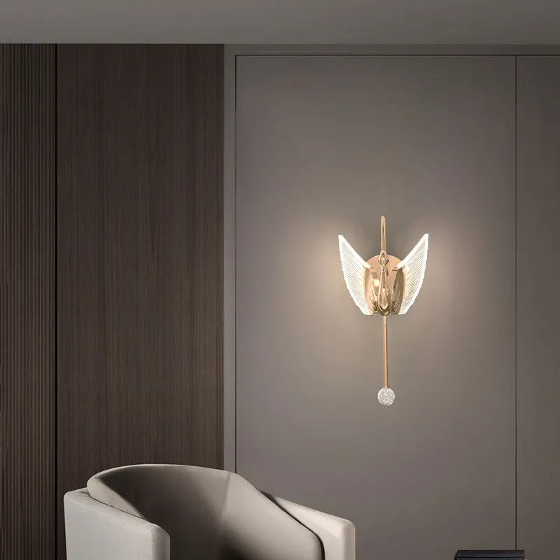 Modern gold swan-shaped wall lamp with acrylic shade and dimmable LED light.