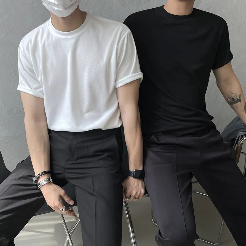 Men's slim fit cotton t-shirt in white or black with round neck and half sleeves.