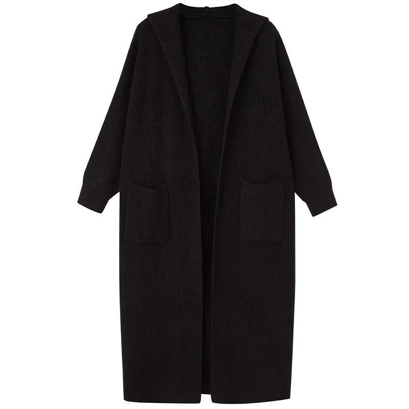 Long grey knitted hooded trench coat cardigan on a hanger, showing loose fit and long sleeves.