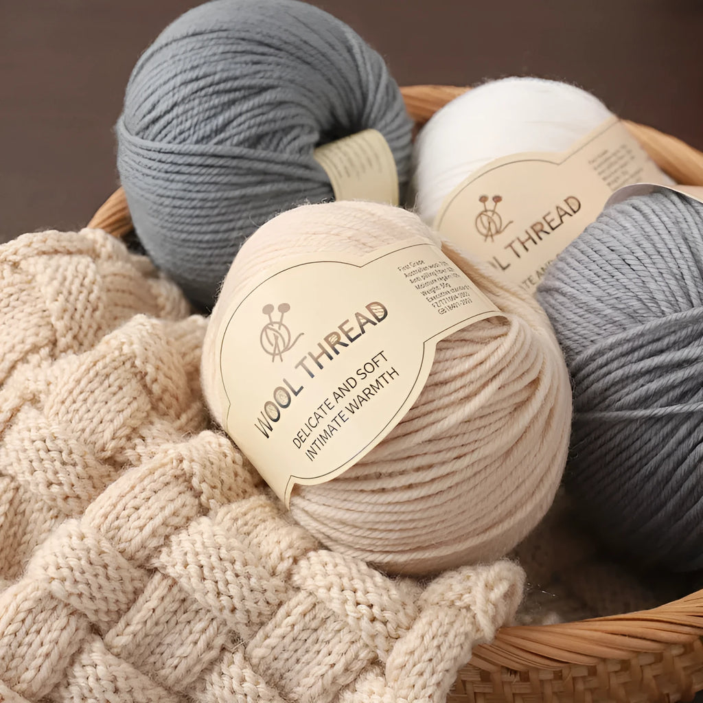 A roll of hand knitting wool thread in a choice of colours for baby sweater projects.