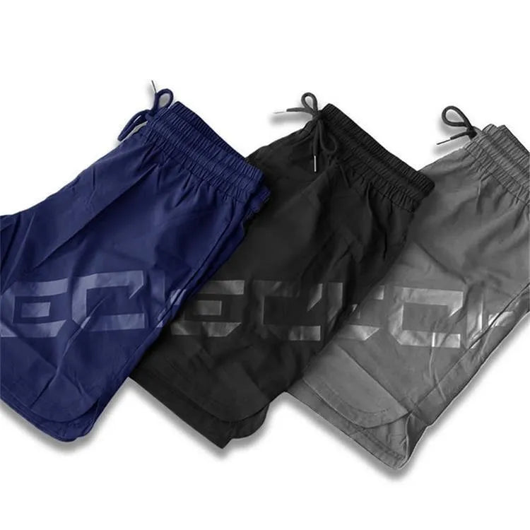 Men's black elastic knee-length training shorts with quick-drying fabric