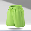 Men's loose-fitting quick-dry ice silk sports shorts on a summer background.
