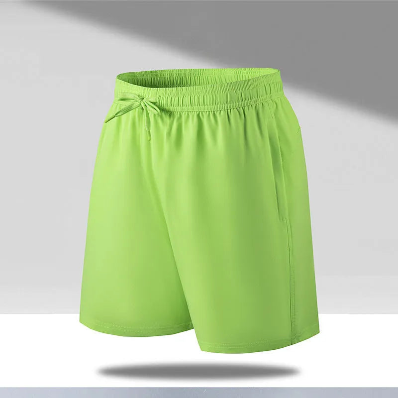 Men's loose-fitting quick-dry ice silk sports shorts on a summer background.