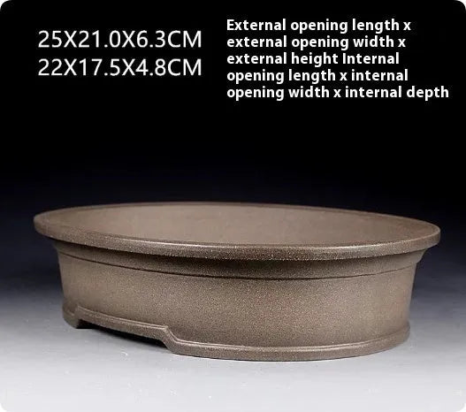 Handmade purple sand clay oval bonsai flower pot showing antique shape and 25x21x6.3cm dimensions