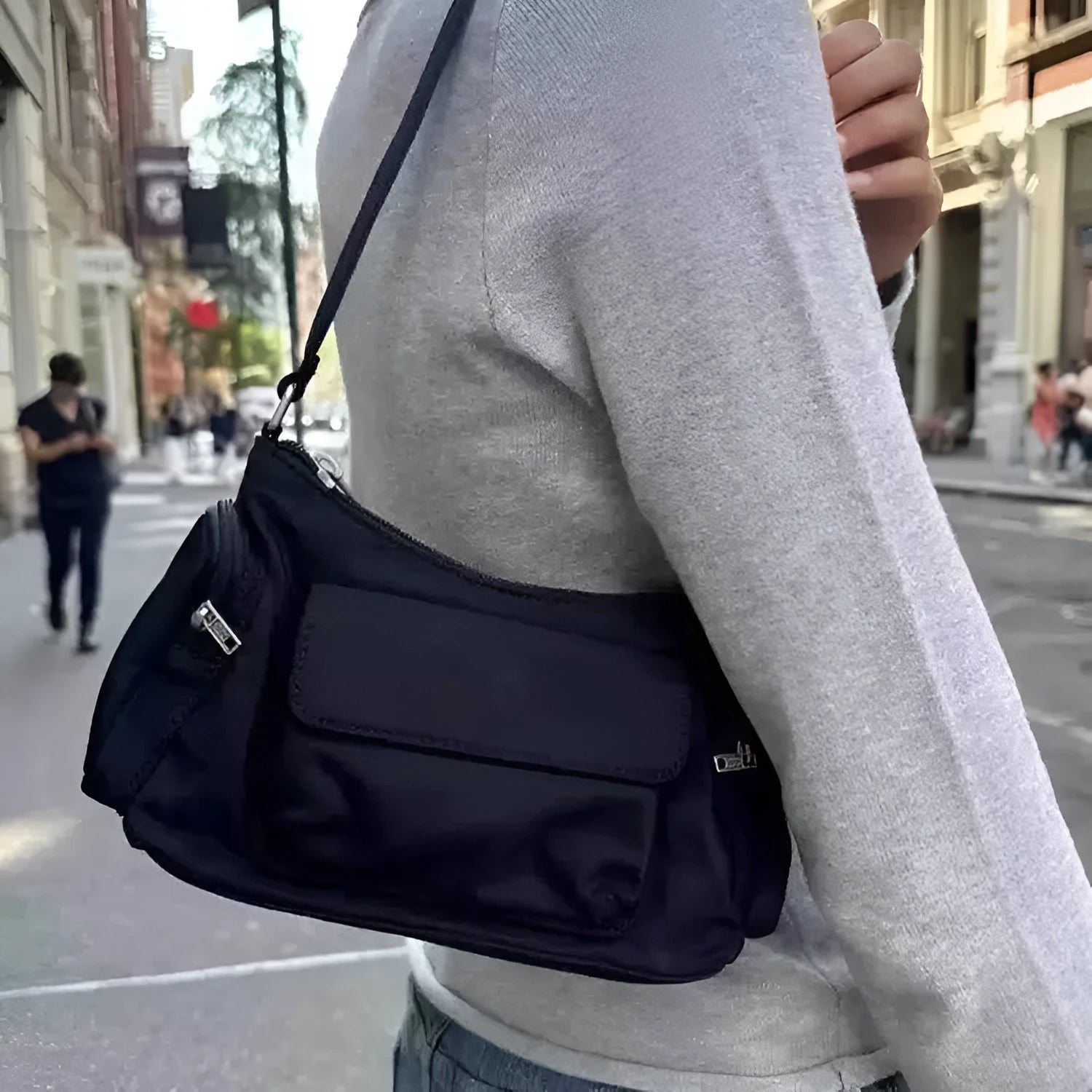 Black PU women's shoulder bag with double pockets and side line detail.