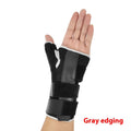 Black carbon fiber sports wrist guard with grey edging and an adjustable thumb strap.