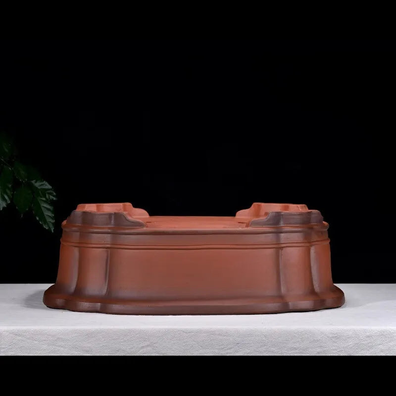 Large antique finish purple clay flower pot with Chinese tree stump design showing pine cypress pomegranate motifs