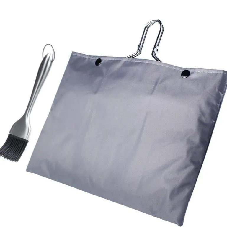 Square stainless steel folding barbecue mesh basket with a cleaning brush on a grill