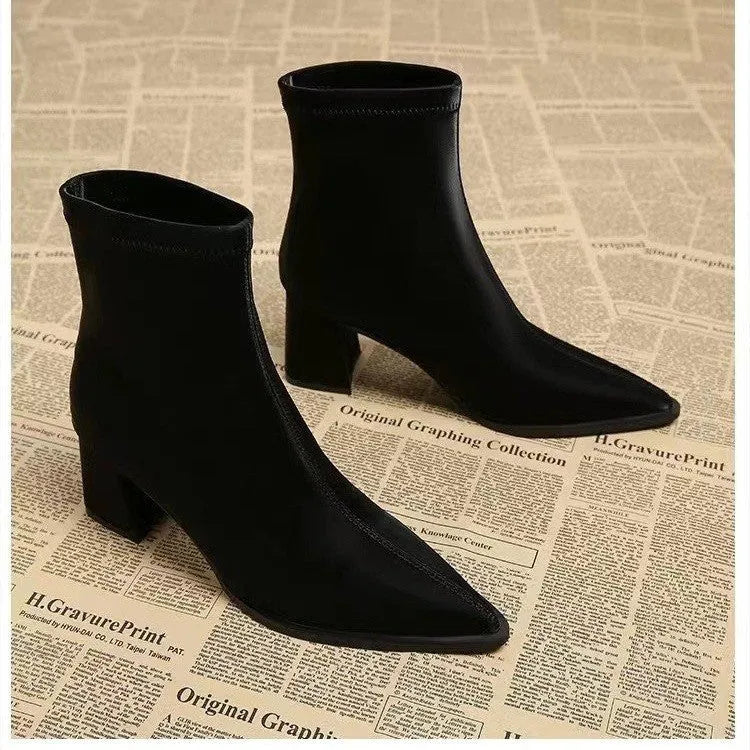 Women's khaki stretch suede pointed toe ankle boots with wedge heels on white background