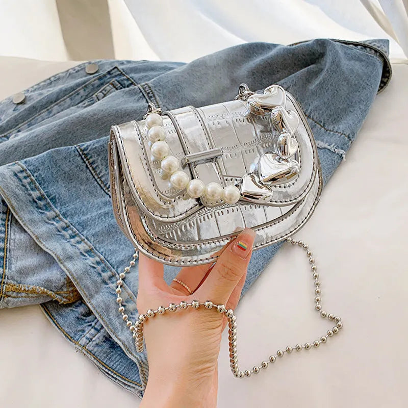 Women's silver PU mini saddle crossbody bag with phone pocket and single shoulder strap