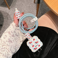 Lambskin USB cable protection sleeve in cartoon puppy designs including checkered, polka dot, and striped patterns