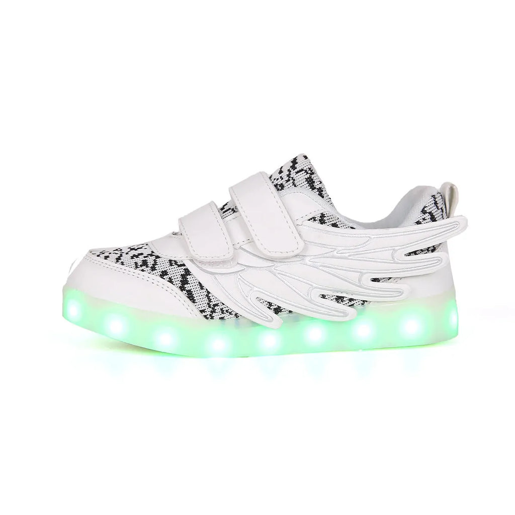 Children's plum red and white LED light-up sneakers with USB charging port visible.