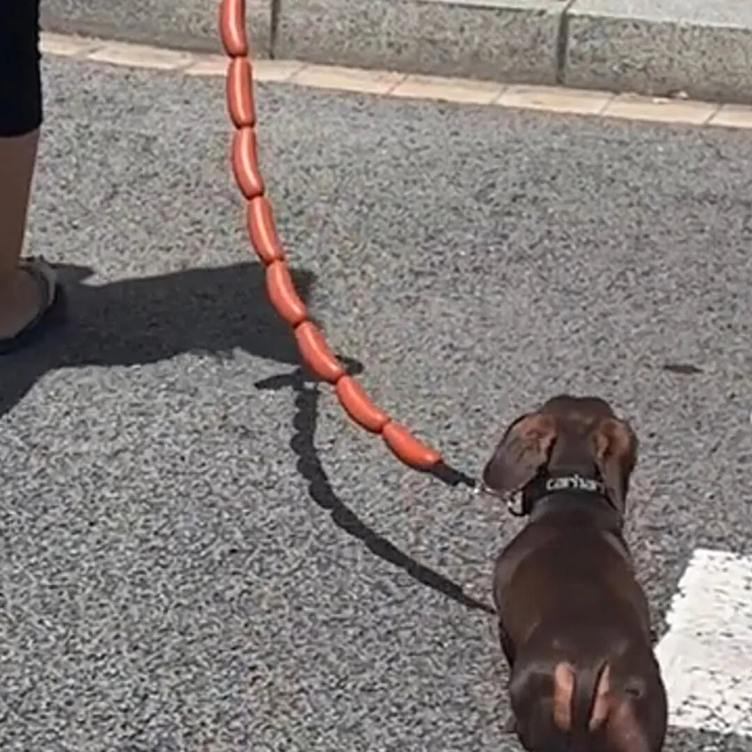 Brown sausage-link dog hand rope toy with grip tape, total length 108cm.