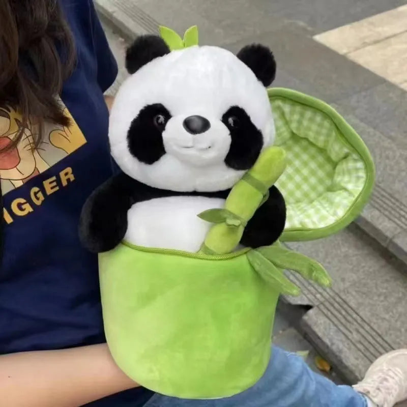Black and white panda plush doll holding green bamboo tube, soft toy with PP cotton filling