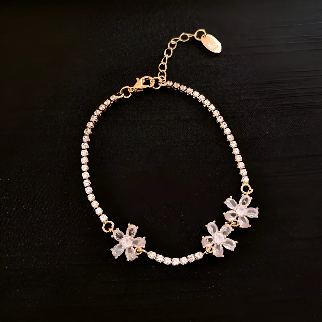 Gold-coloured geometric copper bracelet for women with inlaid zircon stones.