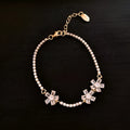 Gold-coloured geometric copper bracelet for women with inlaid zircon stones.