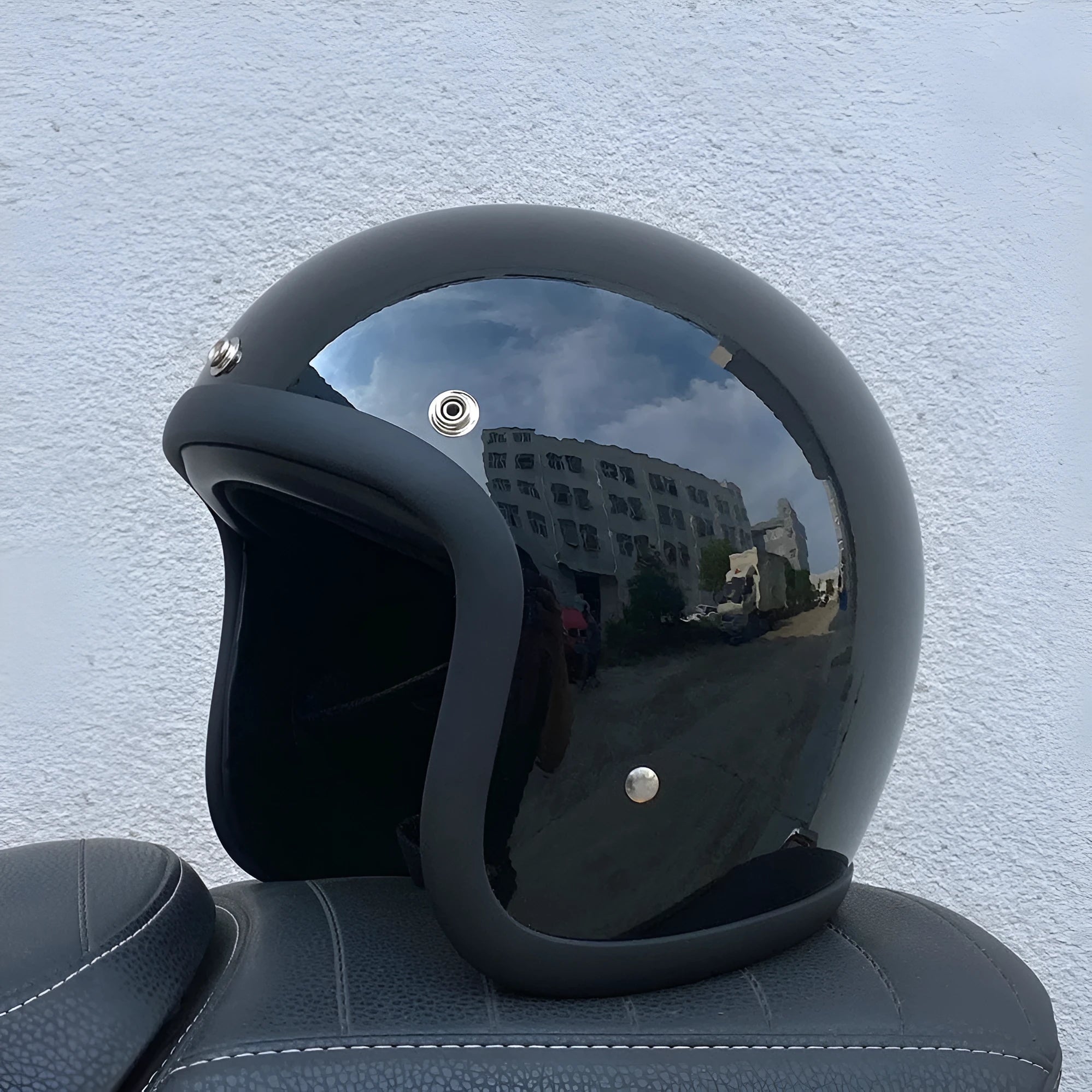 A retro-style fibreglass half motorcycle helmet shown in a cement grey colour, suitable for adult commuting.