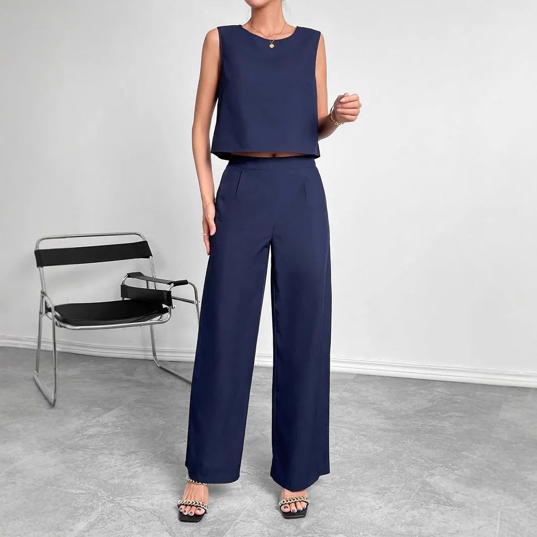 Red sleeveless top and wide leg trouser two-piece set laid flat, showing Asian sizing label.