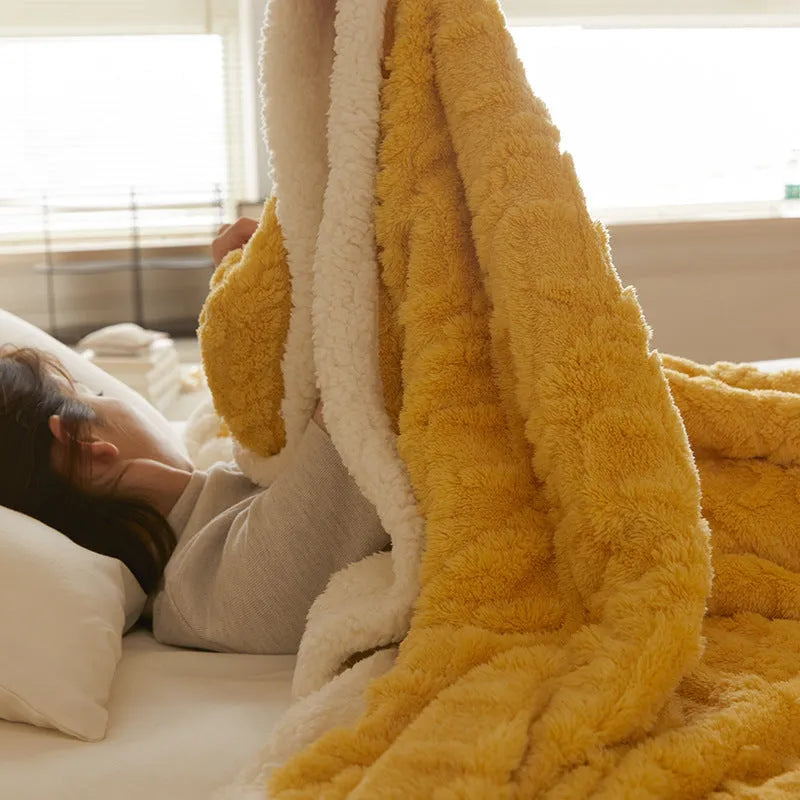 Polyester thermal flannel blanket in tea green colour on a double bed, showing 180x200cm size.