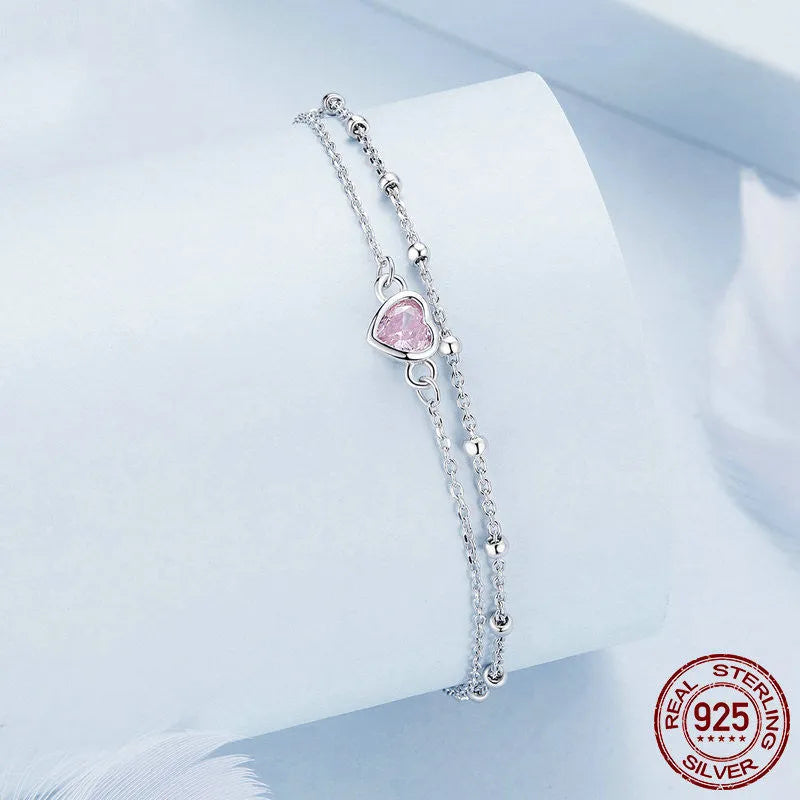 Women's sweet style 925 sterling silver bracelet with small heart charm on an adjustable chain.