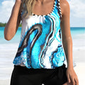 Blue tie-dyed floral pattern plus size women's two-piece swimsuit set with top and shorts.
