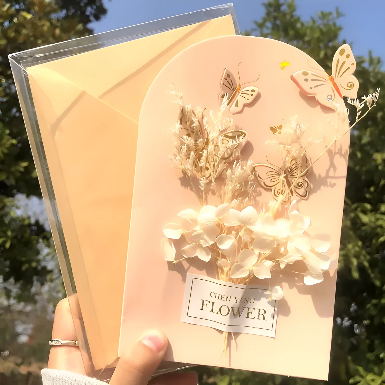 Handmade 3D boxed birthday card with butterfly shape and artificial flowers