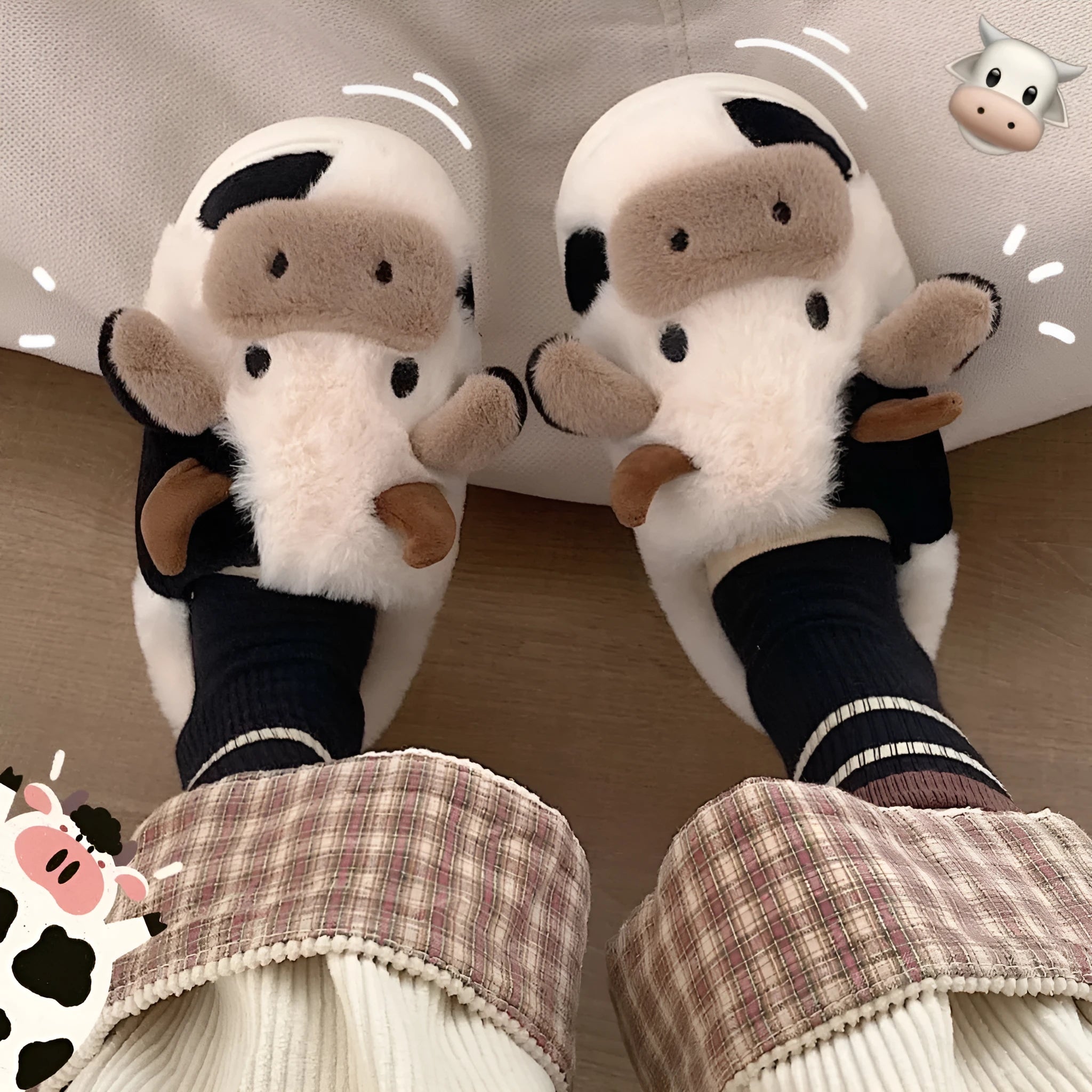 White cow print faux fur slippers for women with a non-slip textured sole.