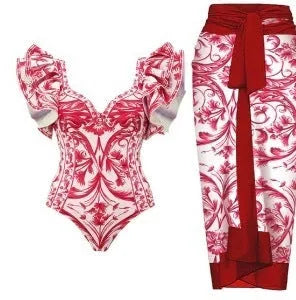 Women's printed polyester one-piece swimsuit on a hanger, showing rose pink, blue, white, and red colour options.