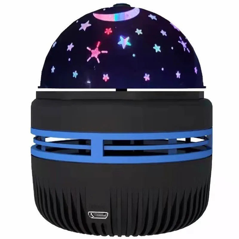 Silver LED galaxy projector lamp with acrylic shade on a table, showing starry light projection on a blue wall.