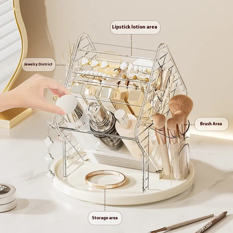 A clear and an amber gold rotating plastic cosmetics storage box on a dressing table.