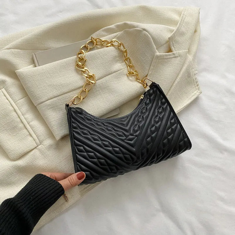 Brown pleated PU leather women's baguette shoulder bag with a chain strap and soft carry handle.