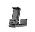 Foldable rotating phone holder in black, shown in use with a mobile phone on a desk