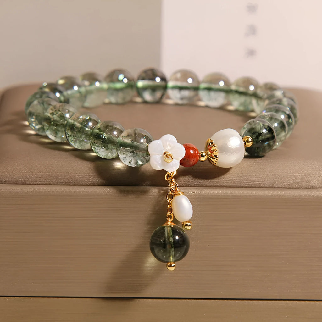 Green phantom quartz crystal bracelet with shell flower and Bells of Ireland design
