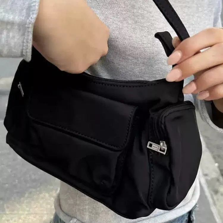 Black PU women's shoulder bag with double pockets and side line detail.
