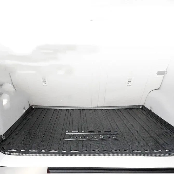 Black carbon fibre pattern TPE boot liner mat for car tailbox protection.