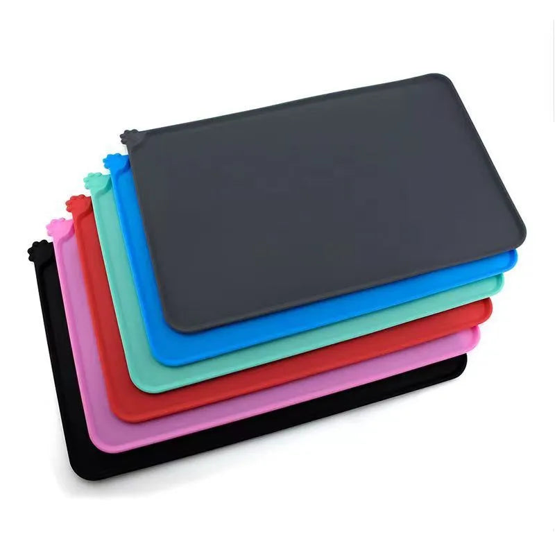 Silicone pet food placemat with non-slip backing in various colours for dogs and cats.