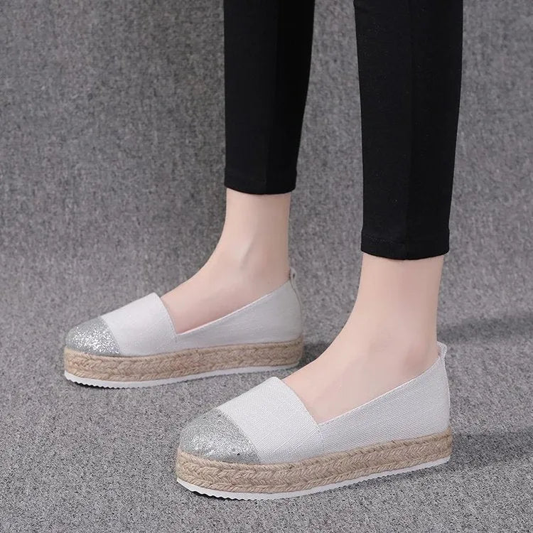 Plus size canvas oversleeve shoes in black and beige colours showing round toe design