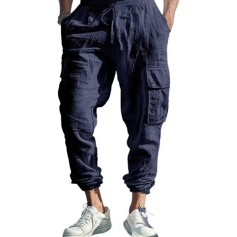 Men's ankle-tied linen trousers in Army Green colour showing multi-pocket design and drawstring waist