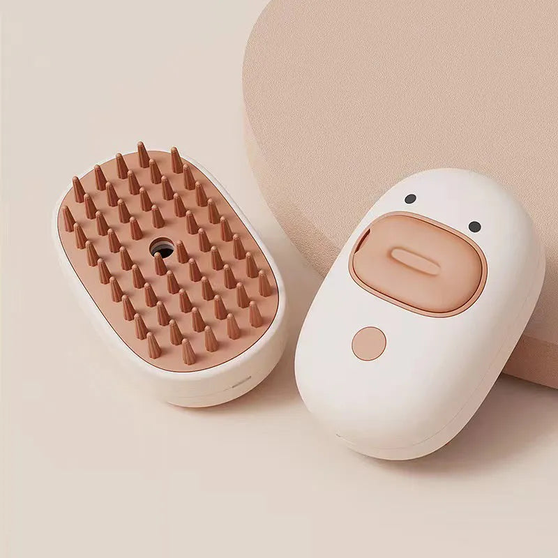 White pet steam brush with silicone teeth and water tank for cat and dog grooming
