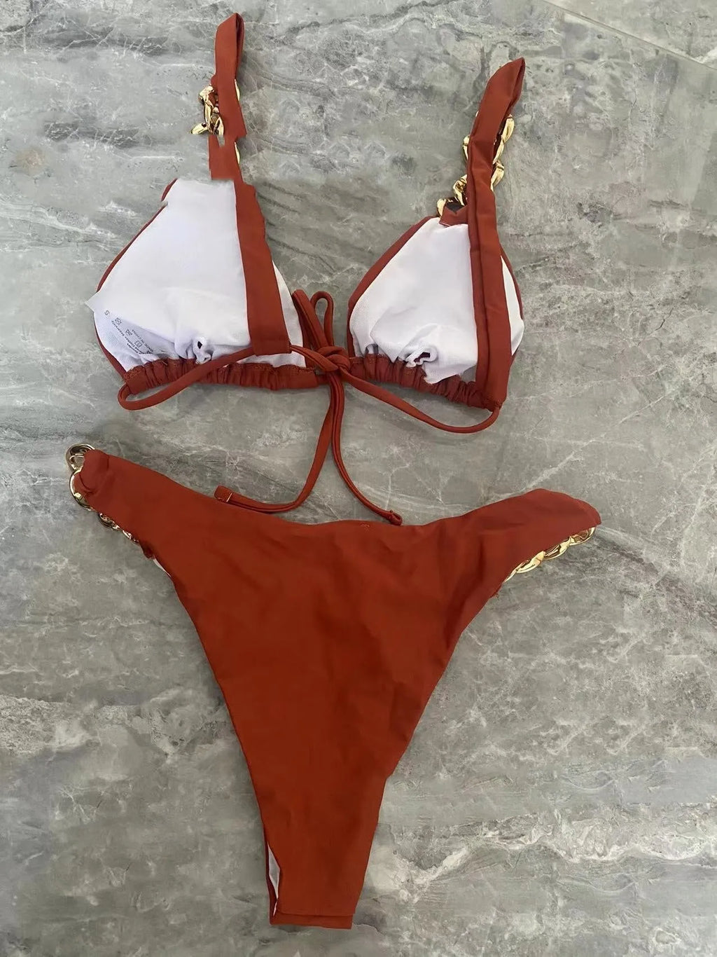 Brown women's tube top push-up split bikini swimsuit on a mannequin.