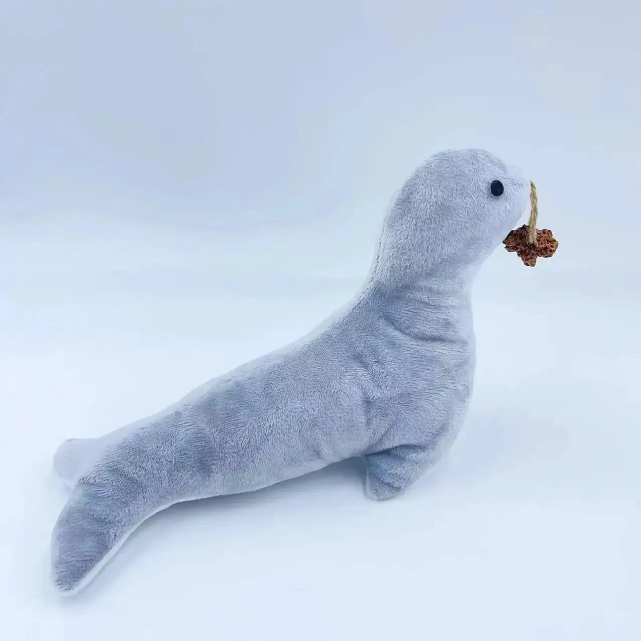 Blue sea lion plush cat toy with bell sound, catnip, and teeth grinding surfaces